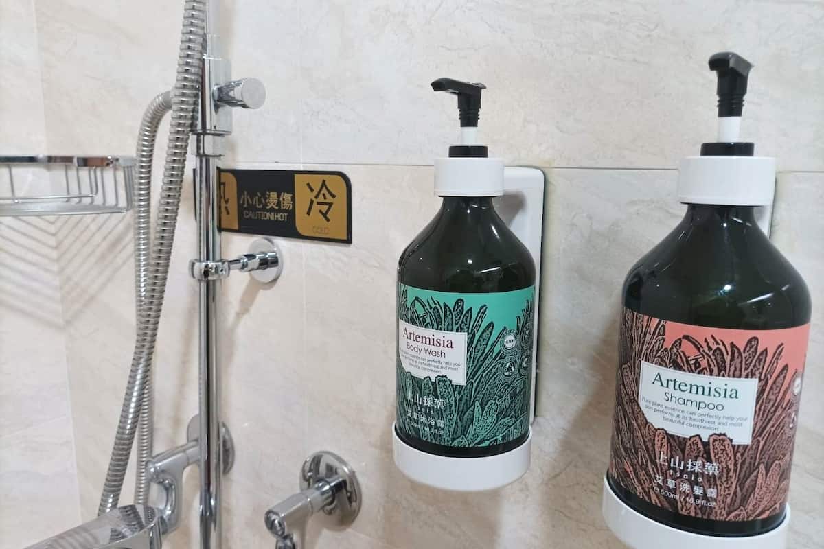 shower, rainfall showerhead, hair dryer, towels