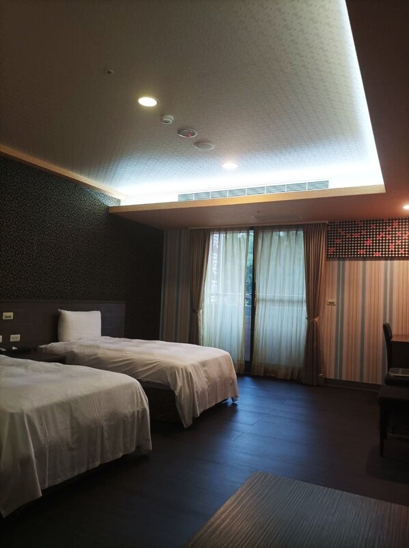 Desk, blackout curtains, free WiFi, bed sheets