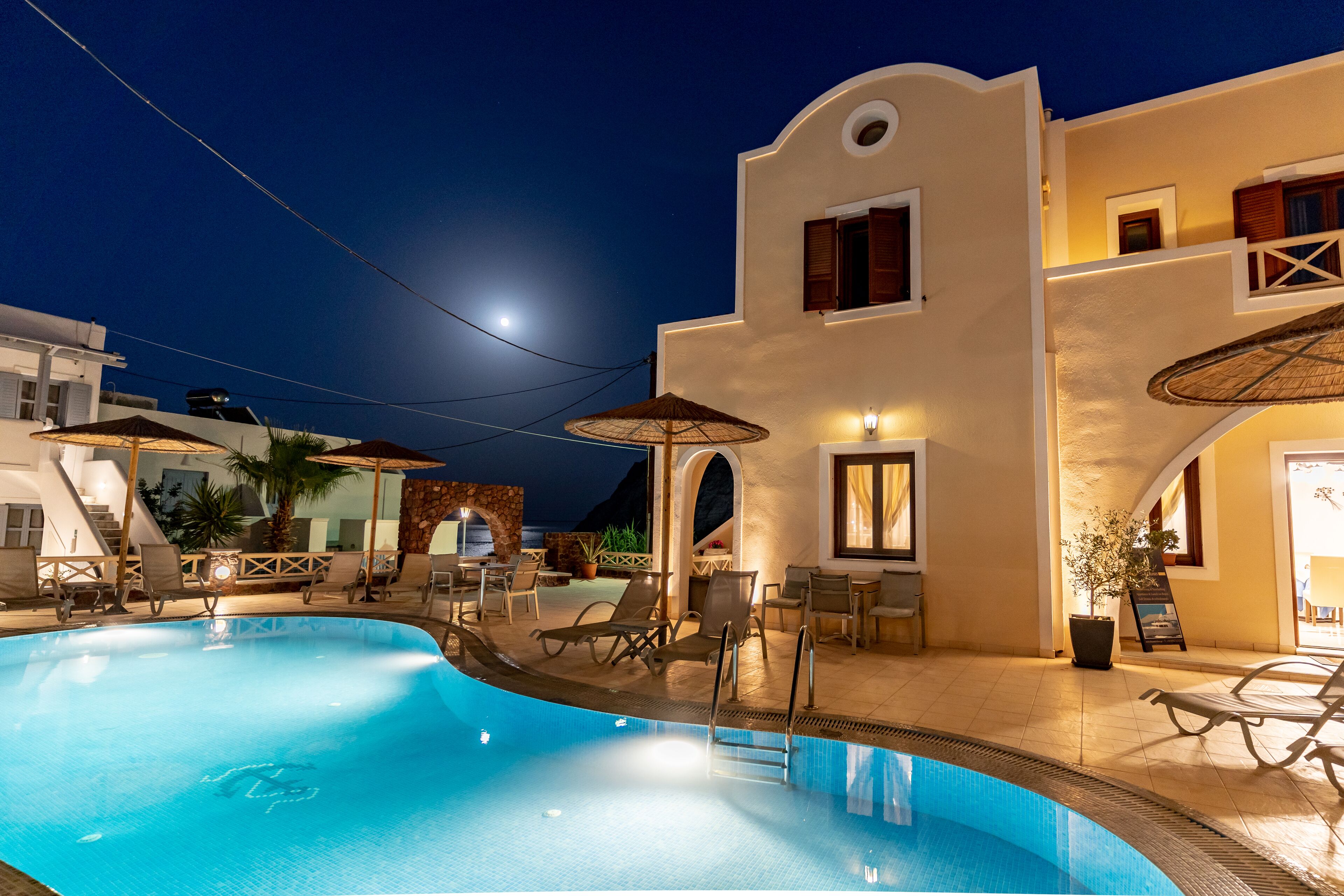 outdoor pool, open 9 am to 7 pm, pool umbrellas, pool loungers