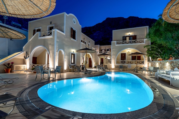Outdoor pool, open 9 AM to 7 PM, pool umbrellas, sun loungers