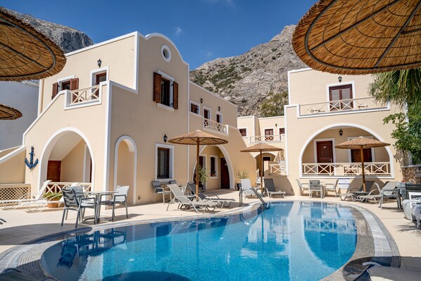 Outdoor pool, open 9 AM to 7 PM, pool umbrellas, sun loungers