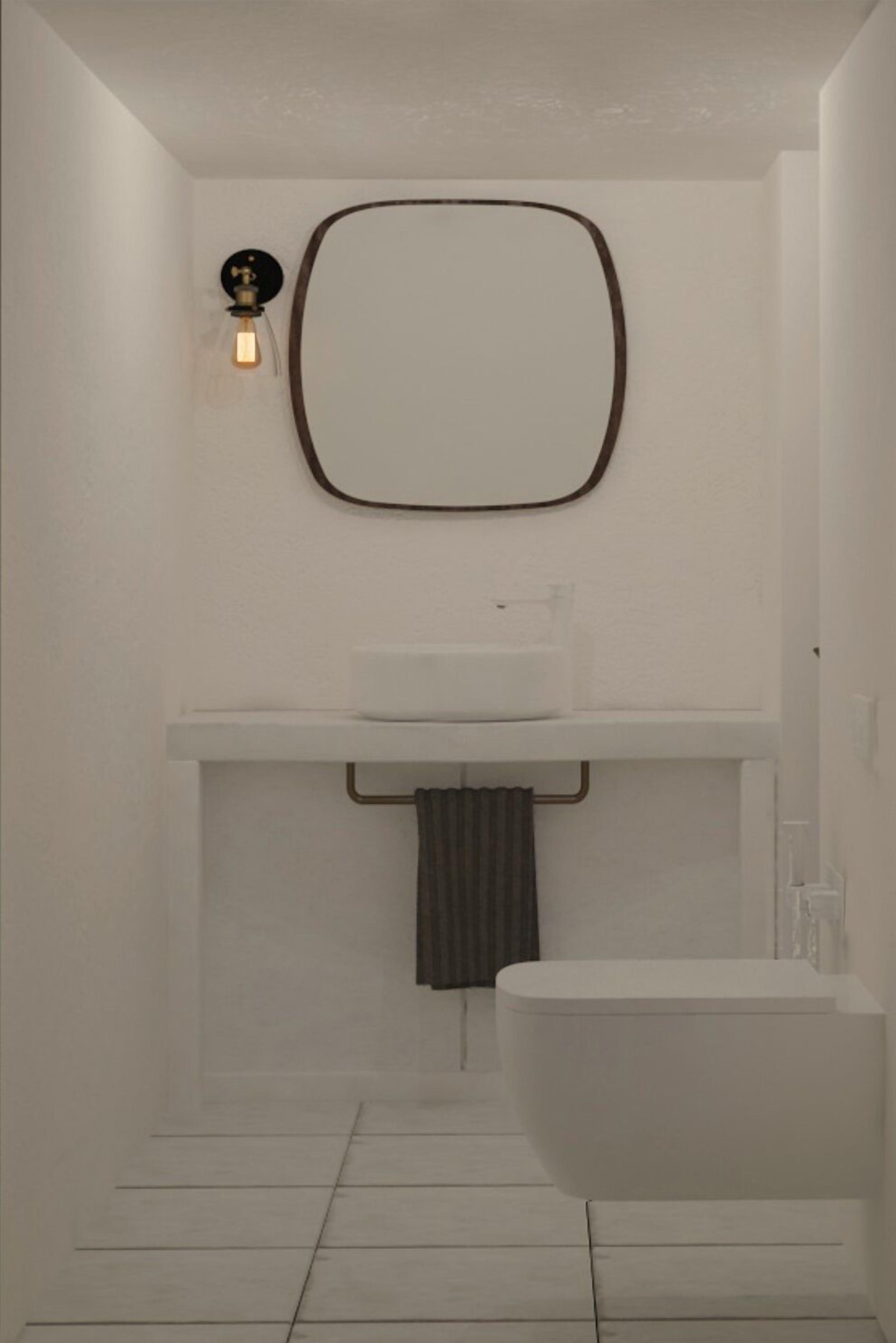 Un baño moderno con una bañera independiente, un lavamanos fijado a la pared y un perchero para toallas.