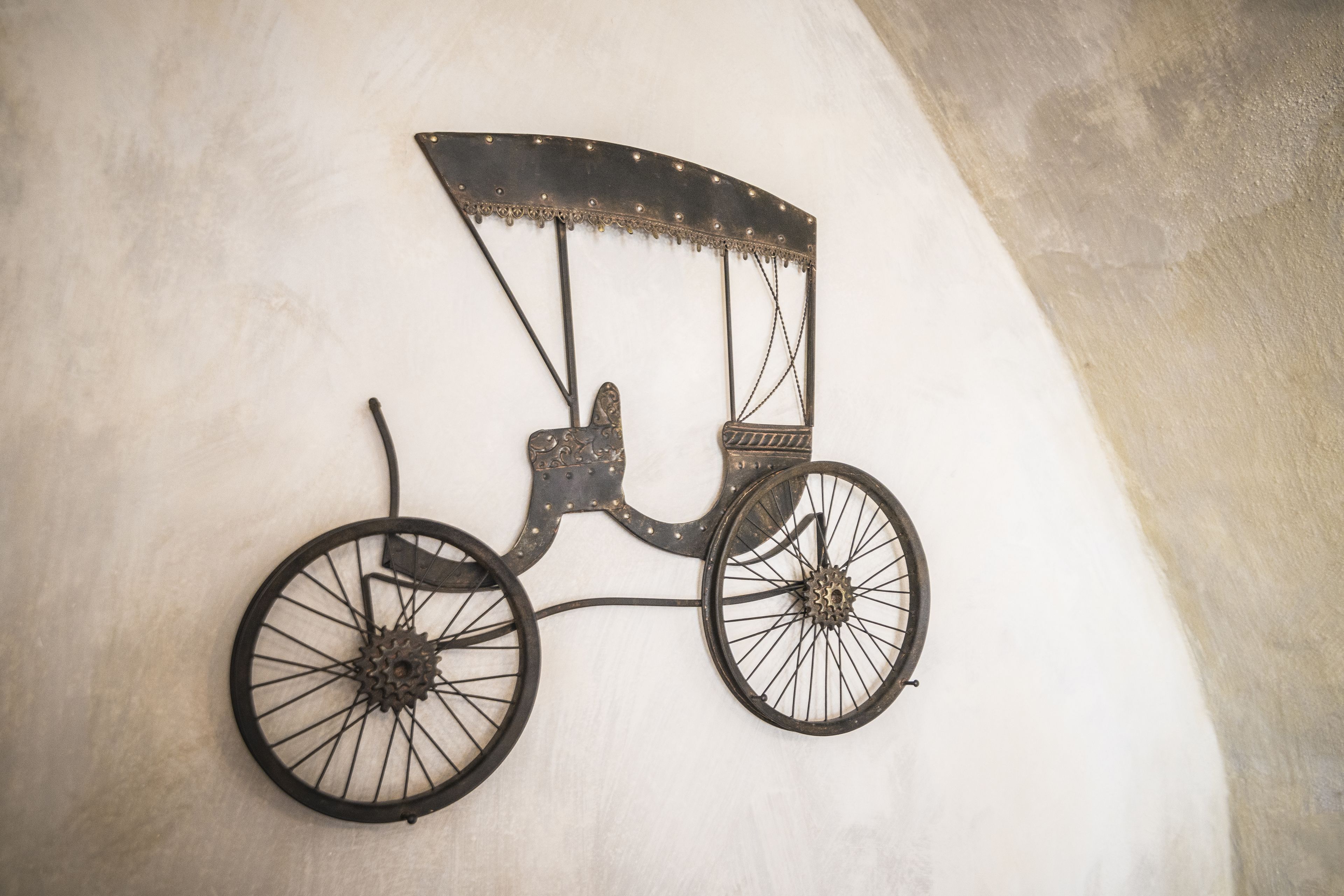 A wall-mounted decorative metal bicycle.