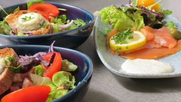 Three bowls of food with different ingredients.