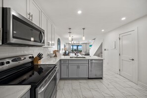 Townhome, 2 Bedrooms | Private kitchen | Fridge, microwave, oven, coffee/tea maker - Seacrest - 6 - 2 Br townhouse by RedAwning (Panama City Beach)