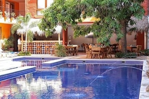 Outdoor pool, open 9:00 AM to 9:00 PM, pool umbrellas, pool loungers