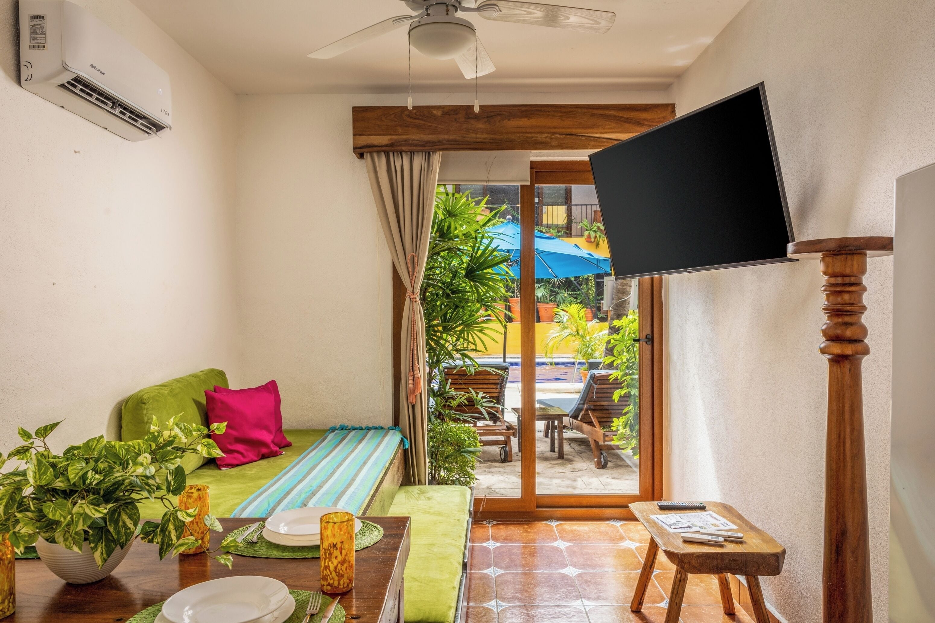 family suite with kitchenette and walk to pool | living area | 55-inch smart tv with satellite channels, tv