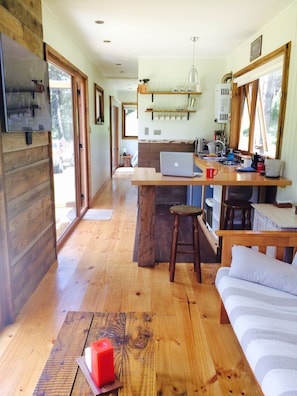 Standard Triple Room | Living area | Flat-screen TV