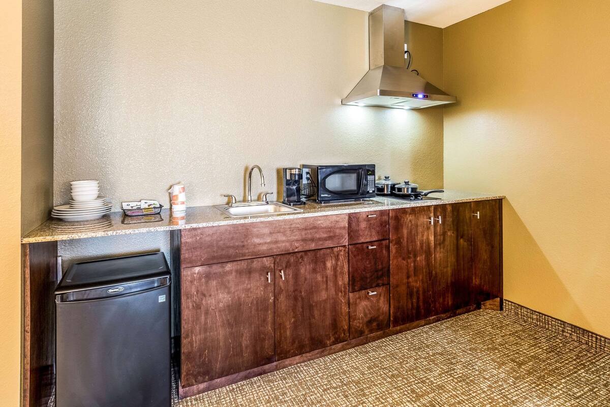 suite, 1 king bed with sofa bed, non smoking, kitchenette | desk, iron/ironing board, cots/infant beds, free wifi