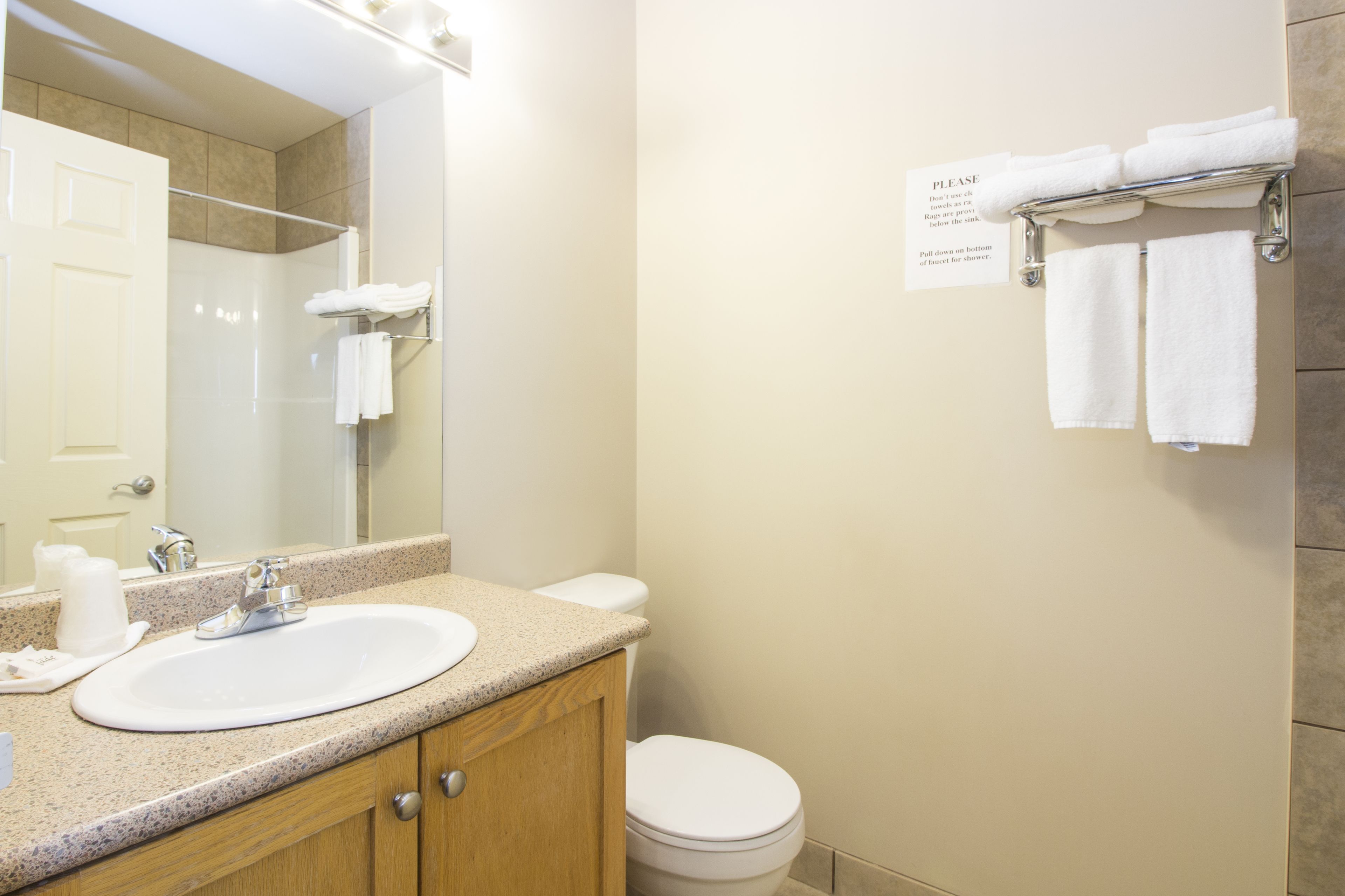 combined shower/bathtub, deep-soaking bathtub, towels