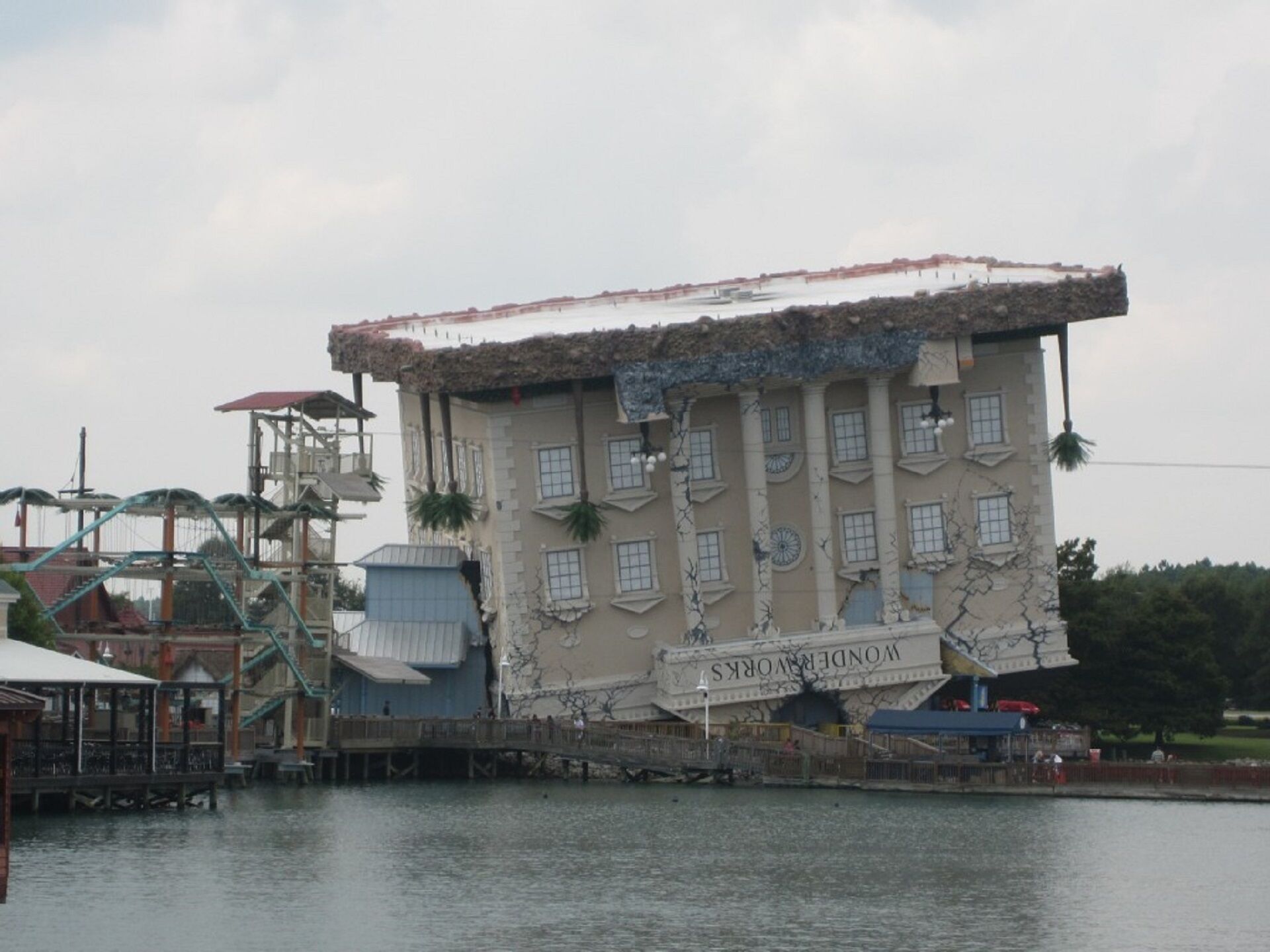 A large building with the sign 'WONDERLOWS' on its facade, situated by a body of water.