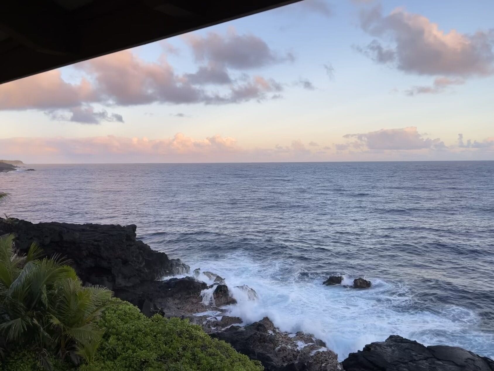 A coastal view with rocky terrain and vegetation.
