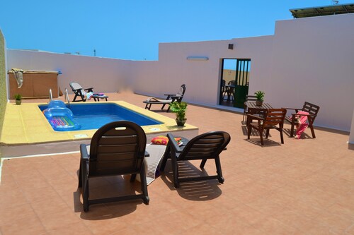 Spacious, quiet house with heated pool and large garden.