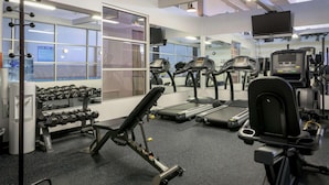 A gym with treadmills, dumbbells, and weight machines. - Ramada by Wyndham Boise (Boise)