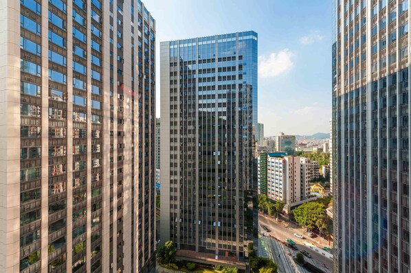 A high-rise building with multiple floors, large windows, and a modern architectural design.