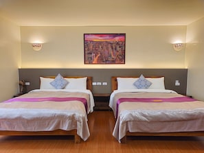 Family Quadruple Room | Down comforters, minibar, blackout drapes, soundproofing - Kenting Dream B&B (Hengchun)