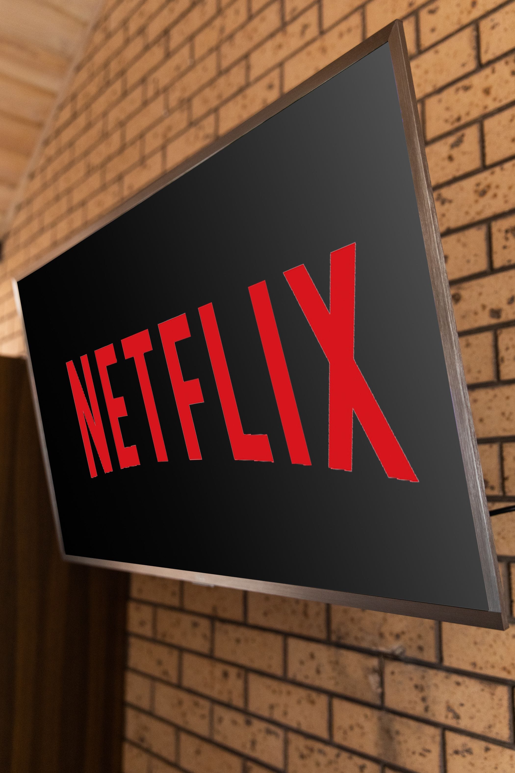 Un cartel con la palabra "NETFLIX" en letras rojas sobre un fondo negro.