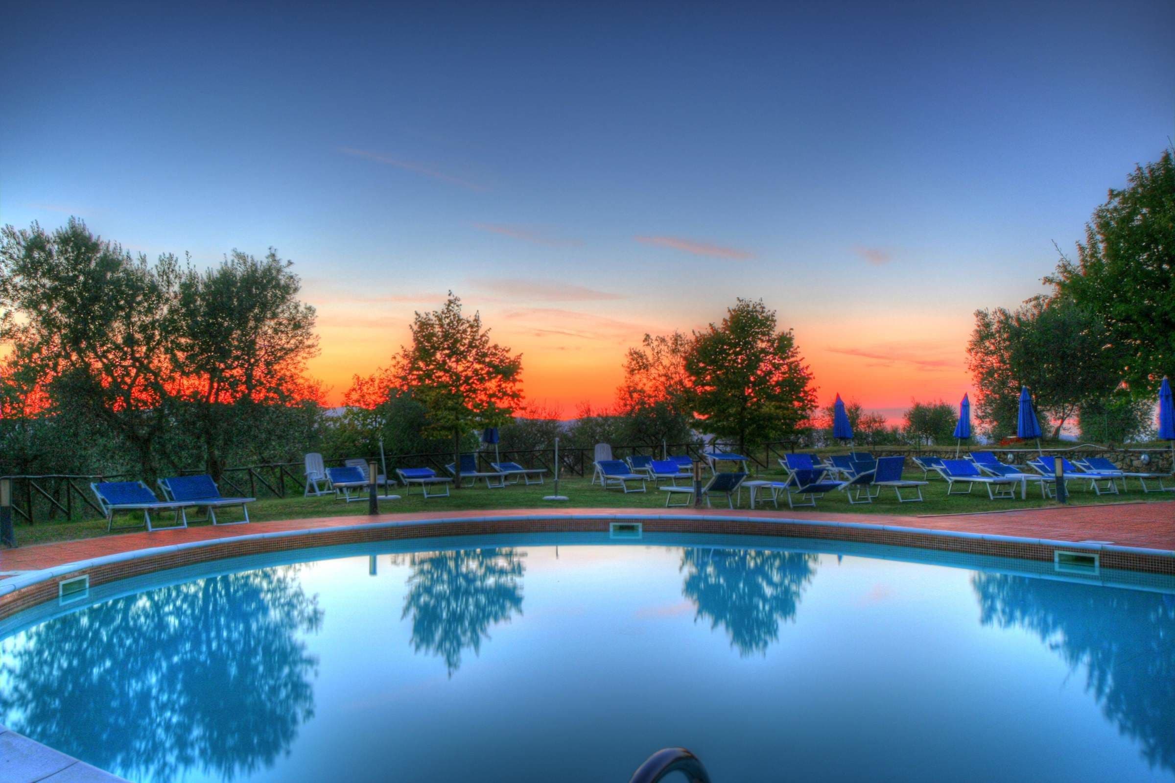 seasonal outdoor pool, pool umbrellas, pool loungers