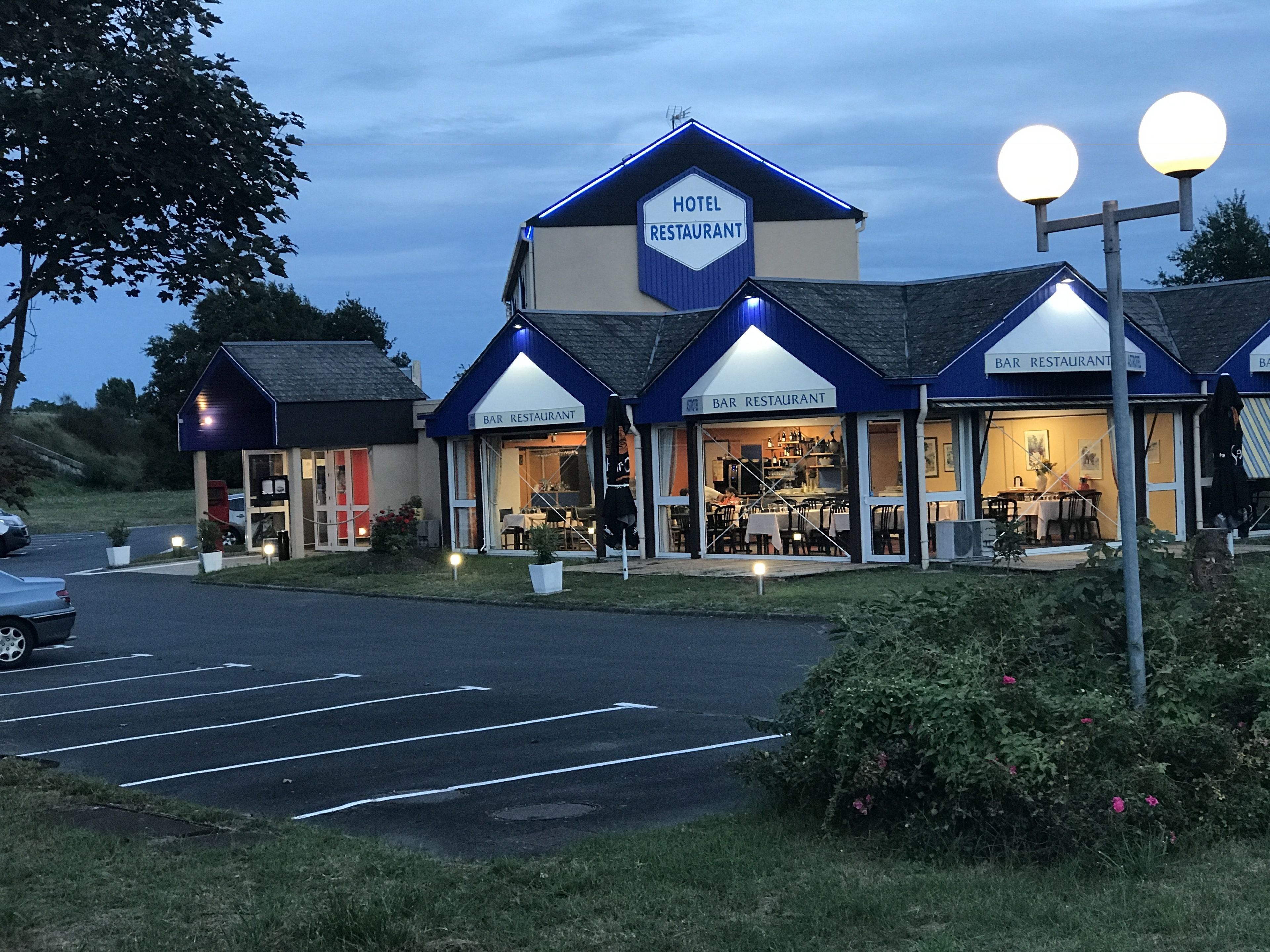 A hotel with a bar and restaurant, featuring a modern design with blue and white colors.