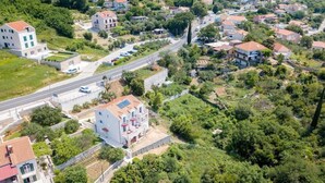 An aerial view of a residential area with houses, roads, and greenery. - Villa Panorama (Zupa dubrovacka)