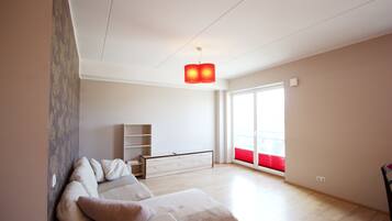 Basic Apartment, 2 Single Beds | Living room | Flat-screen TV
