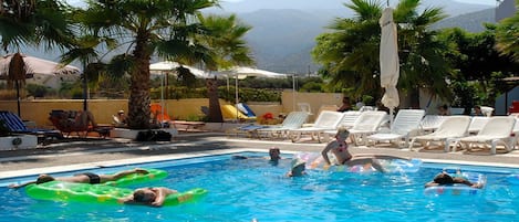 Outdoor pool, pool umbrellas, pool loungers