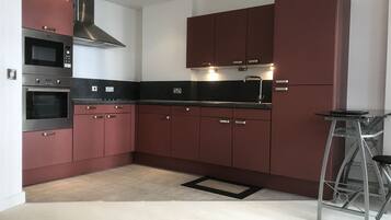 Luxury Apartment, 1 Bedroom | Private kitchen | Full-sized fridge, microwave, oven, stovetop