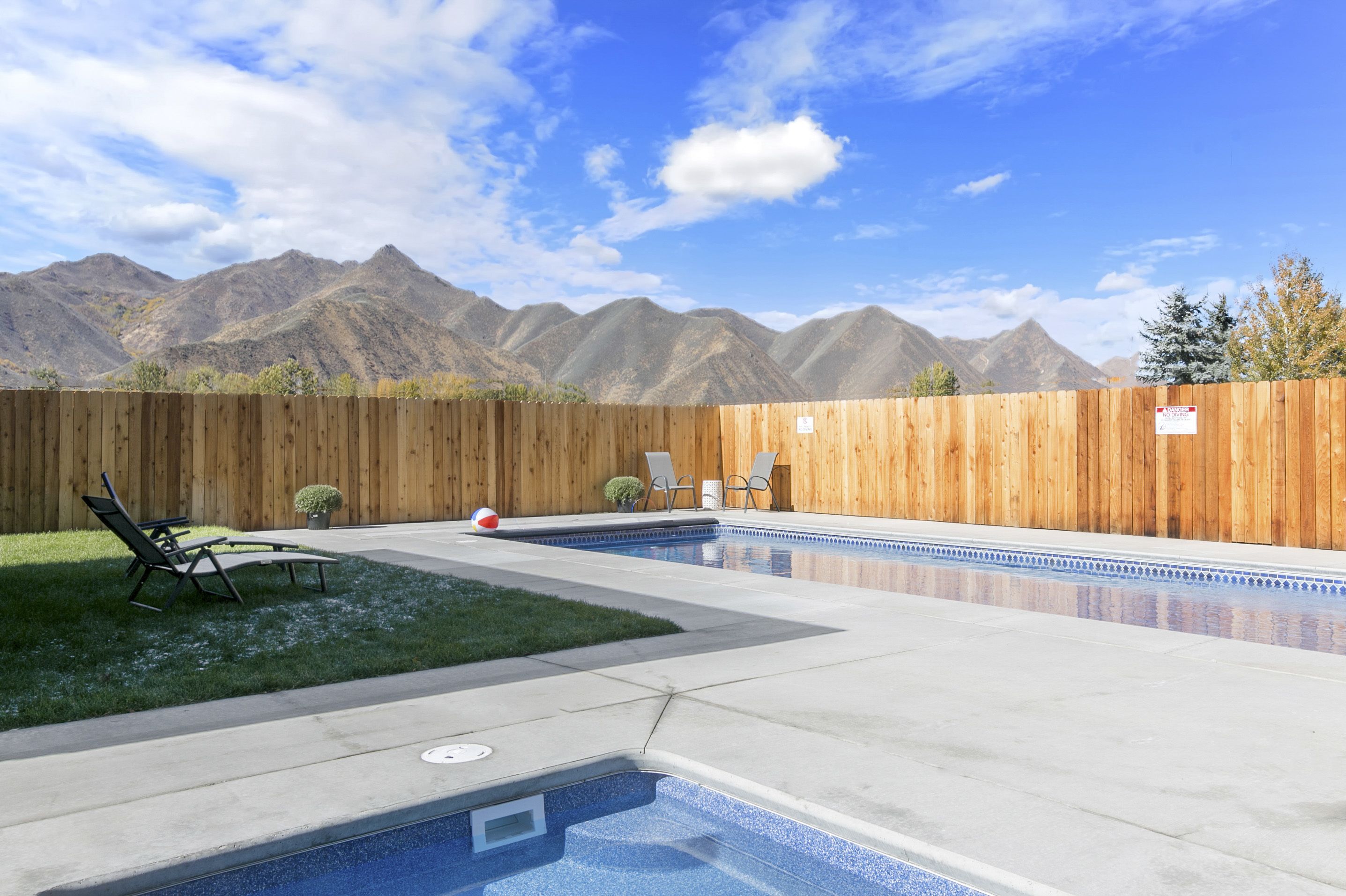 outdoor pool, a heated pool, open 6:30 am to 10:30 pm, pool umbrellas