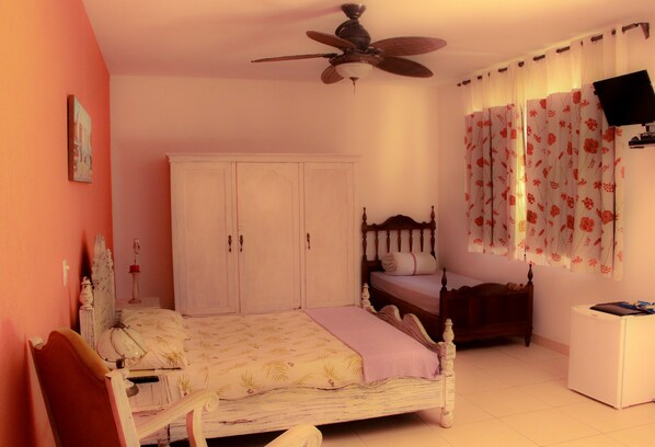 Comfort Triple Room, Multiple Beds, Garden Area | Minibar, blackout curtains, soundproofing, iron/ironing board