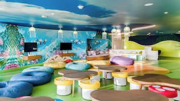 Kids can play and socialize in this vibrant play area with a fun underwater mural and comfortable seating.