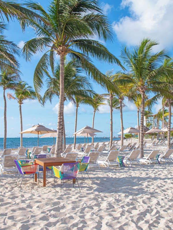 On the beach, white sand, free beach cabanas, sun loungers