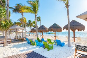 On the beach, white sand, free beach cabanas, sun loungers