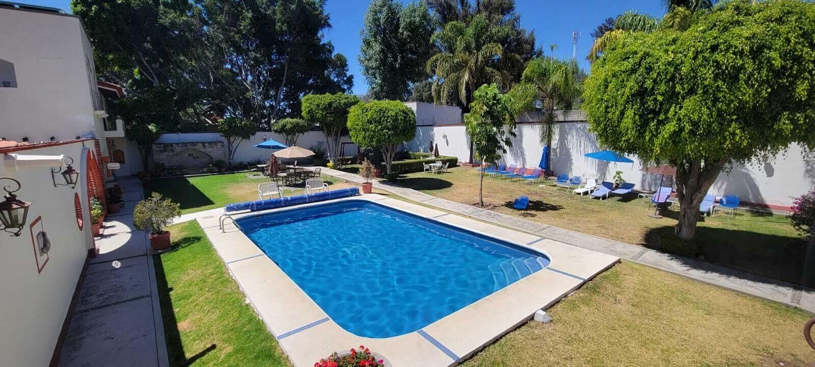 outdoor pool, pool umbrellas, pool loungers