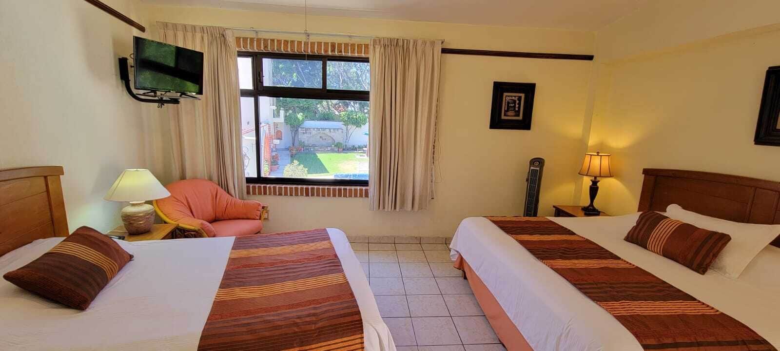 double room, multiple beds | bed sheets