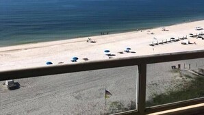 A beach view from a window, with a clear sky and calm sea. - Unit #802 Beautiful Spacious Beachfront Condo! Sleeps 10! New Updates!! <br> (Orange Beach)