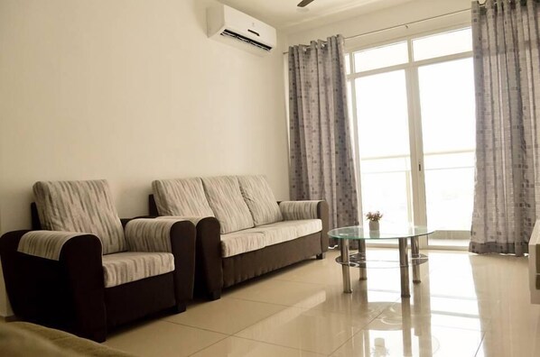 Apartment, 3 Bedrooms | Living room | LCD TV - Summertime Arena Suite 1 (George Town)
