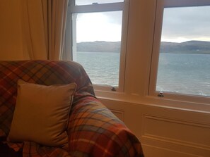A room with a window overlooking a body of water and hills. - Kames Hotel (Tighnabruaich)