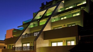 A modern building with multiple balconies and a unique geometric facade. - Athens Mosaico Suites and Apartments (Athens)