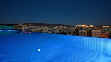 Outdoor pool, open 9:00 AM to 6:00 PM, pool loungers