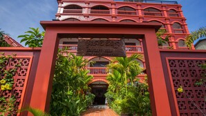 A red building with a sign reading "BOU SAVY VILLA Bed and Breakfast". - Bou Savy Villa (Siem Reap)