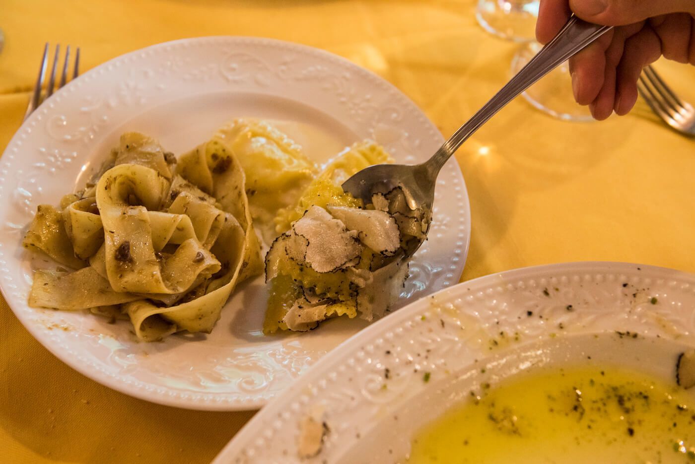 A plate of pasta with a fork.