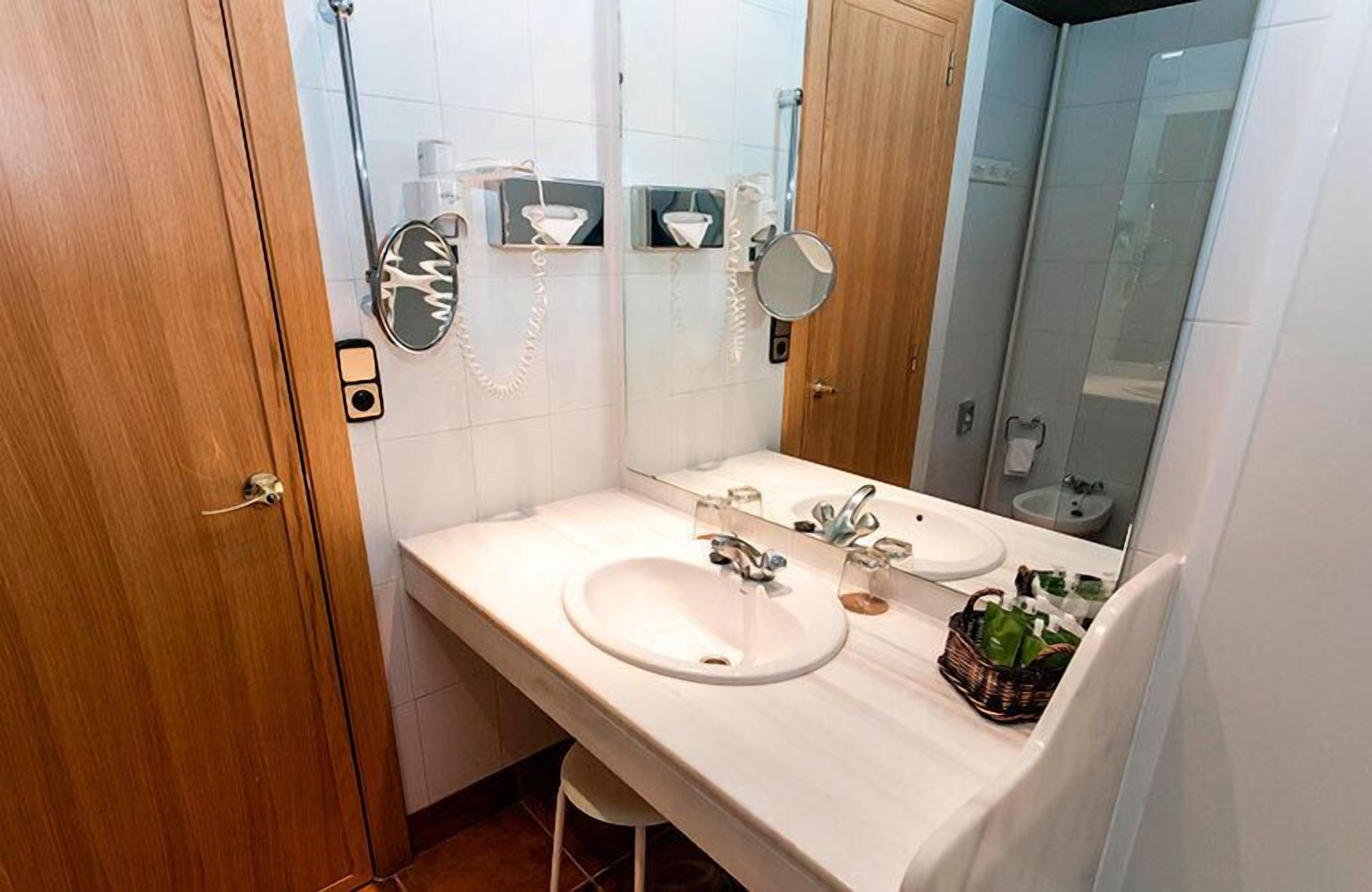 free toiletries, hair dryer, slippers, towels