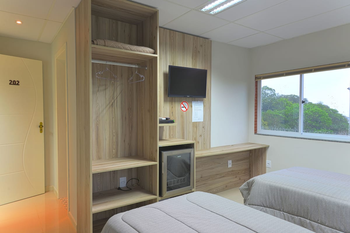 minibar, desk, blackout curtains, iron/ironing board