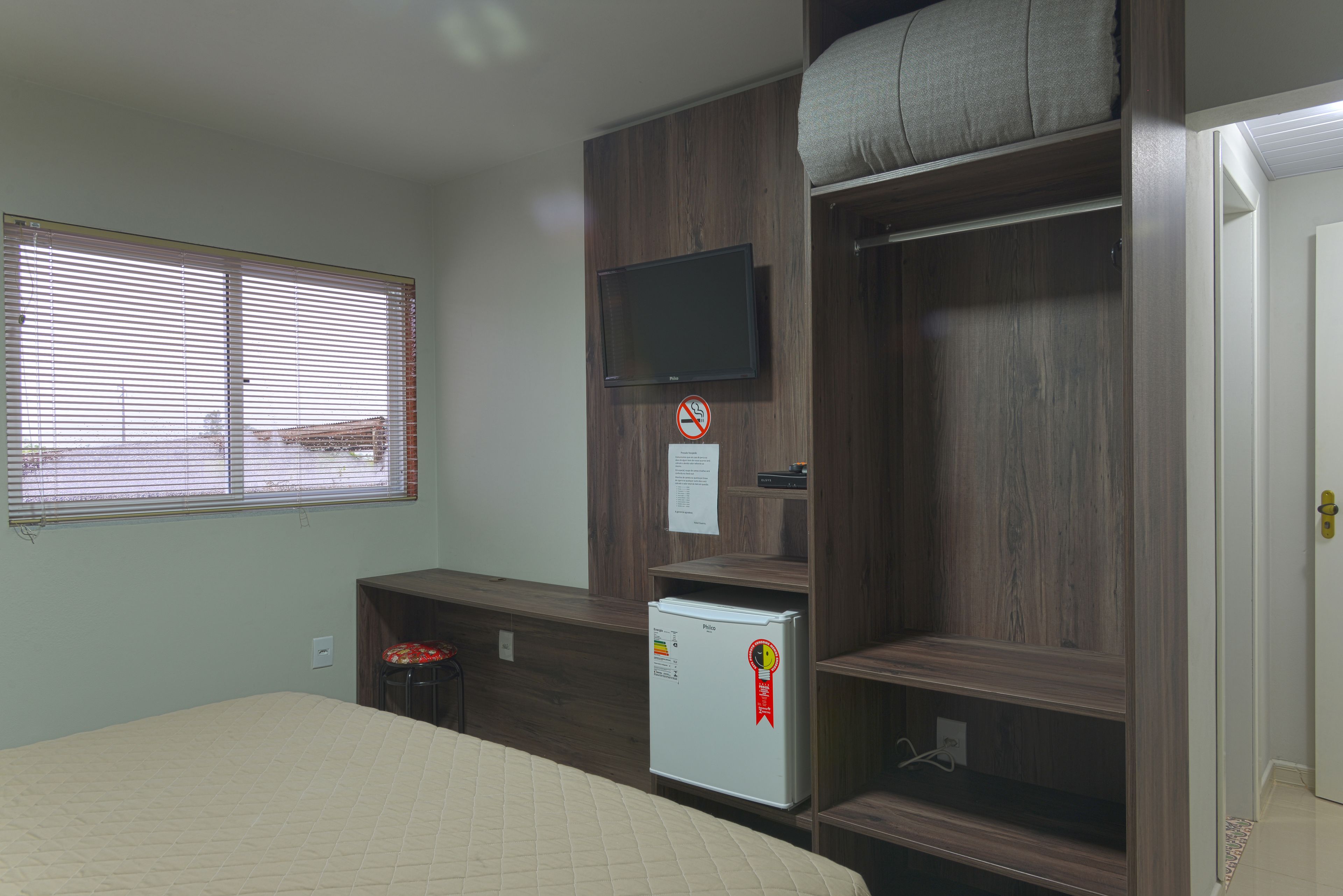 minibar, desk, blackout curtains, iron/ironing board