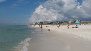 A beach with clear skies and calm waters.
