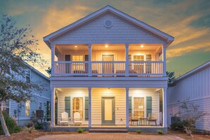 A two-story house with a balcony, a front porch with chairs, and a number '41' on the door. - Cottage 3BR-2.5B walking distance to public beach access - Rosemary Alys 30a (Inlet Beach)