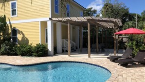 A yellow house with a covered patio and a swimming pool. - F1, Downtown St. Augustine, POOL, beaches, free onsite parking! (Saint Augustine)
