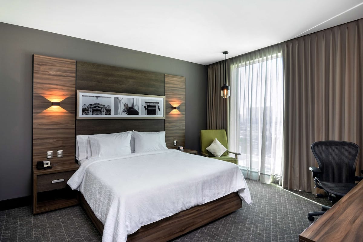 Junior Suite, 1 King Bed | In-room safe, desk, blackout drapes, iron/ironing board