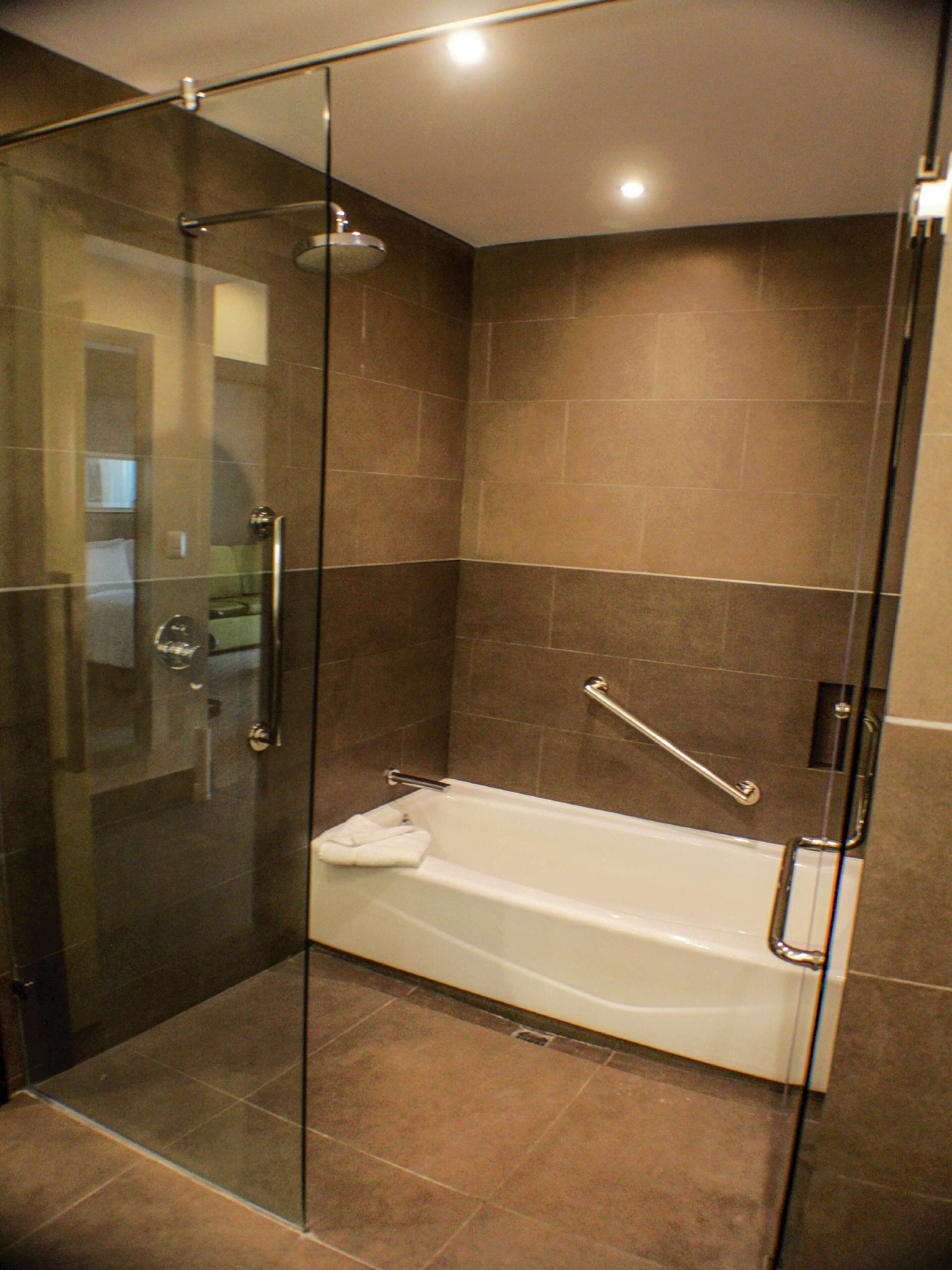junior suite, 1 king bed | bathroom | shower, free toiletries, hair dryer, towels