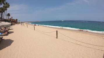 On the beach, sun loungers, beach towels